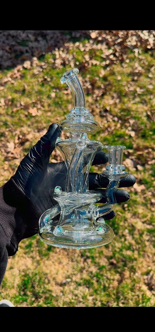 A mesmerizing glass piece that catches the light beautifully.